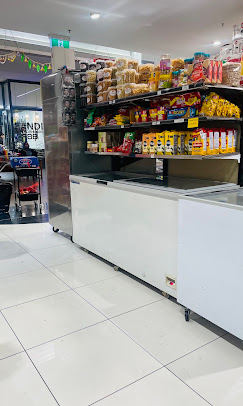 Frozen food display alongside a snacks shelf