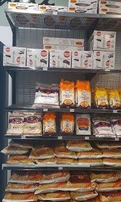 Shelf of rice, dal and kitchen cookware